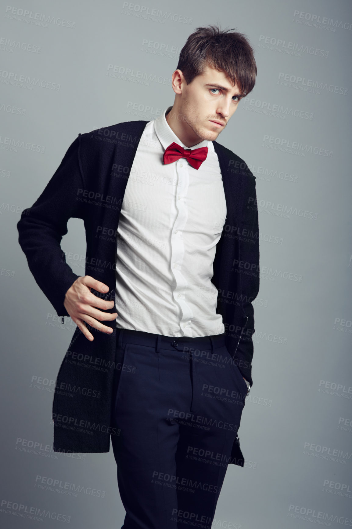 Buy stock photo Portrait, fashion and man with business, professional and confident guy on a grey studio background. Person, corporate and model with suit, elegant outfit and stylish clothes with bow tie and worker