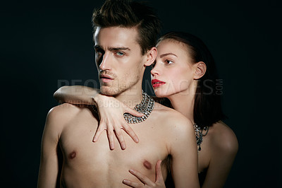 Buy stock photo A young woman and man against a dark background