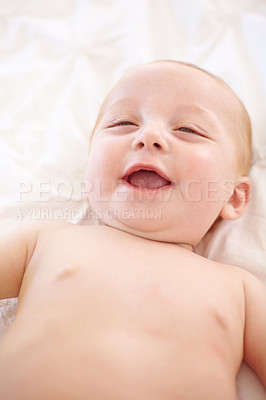 Buy stock photo Happy baby on bed, funny and top view of young child in development, innocent or relax at home. Kid smile above, infant laughing in nursery and rest in bedroom, healthy body or skin, cute or adorable