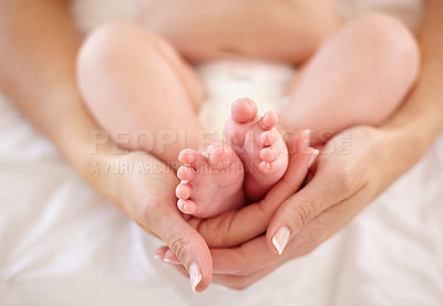 Buy stock photo Woman, child and feet holding for love connection or childhood bonding, motherhood or newborn. Female person, infant and toes or care support for kid growth development, parent trust or nurture youth