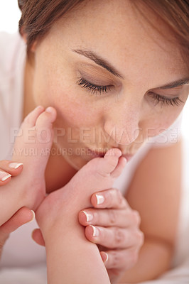 Buy stock photo Mother, love and kiss with baby foot for touch with gratitude, support and mama bond with parent happiness. Woman, smooch and newborn toes with admiration, health wellness and commitment with care