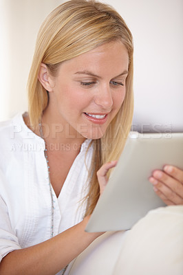 Buy stock photo Home, relax and woman with a tablet, typing and communication with internet, social media and digital app. Person, apartment and girl with technology, connection and  email with a smile and network