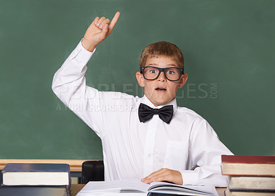 Buy stock photo Young boy, portrait and question at school for learning, education or interaction for knowledge by green chalk board. Face of male person, smart child or teenager with books and hand raised in class