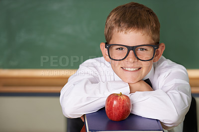 Buy stock photo Happy boy, portrait and books with apple at school for learning, education or nutrition by green chalk board. Face of smart child, kid or young teenager smile for fruit, brain food or diet in class