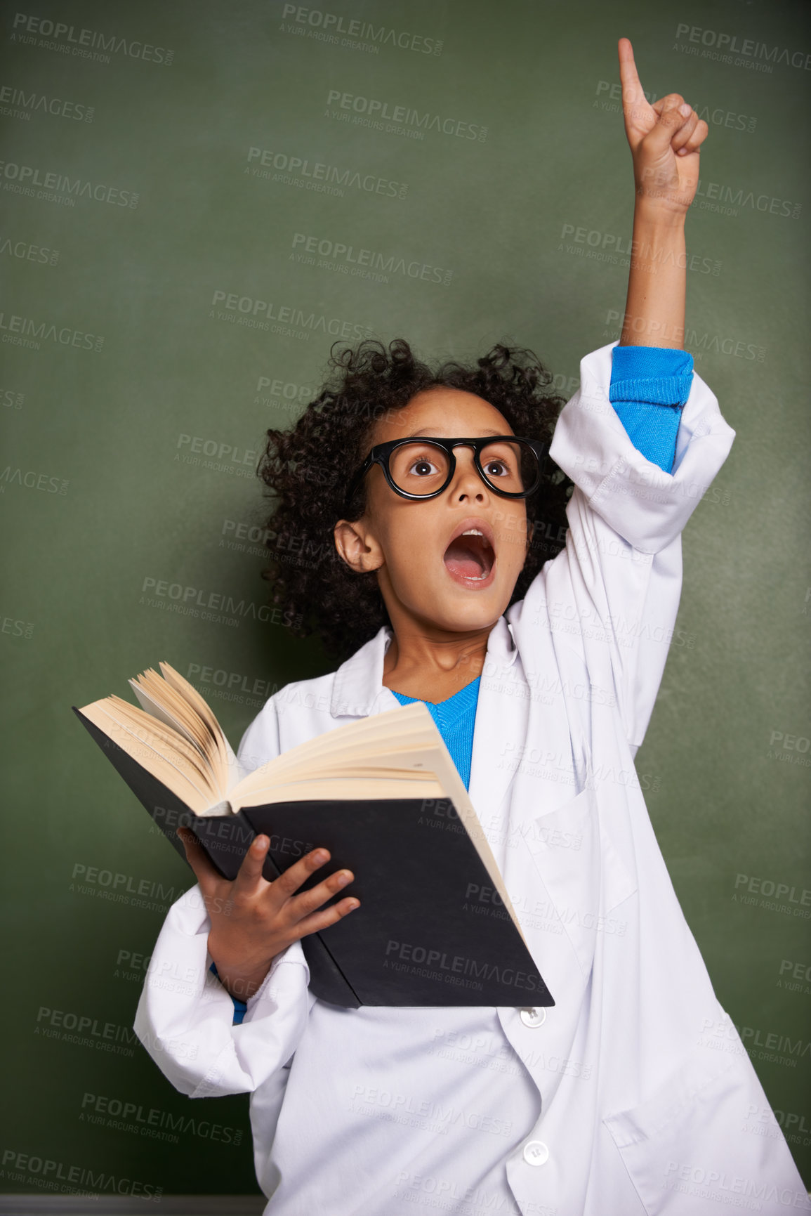Buy stock photo Child, hand for answer and book in classroom, education and science learning or physics knowledge by chalkboard. African student wow with glasses and solution or problem solving in textbook at school