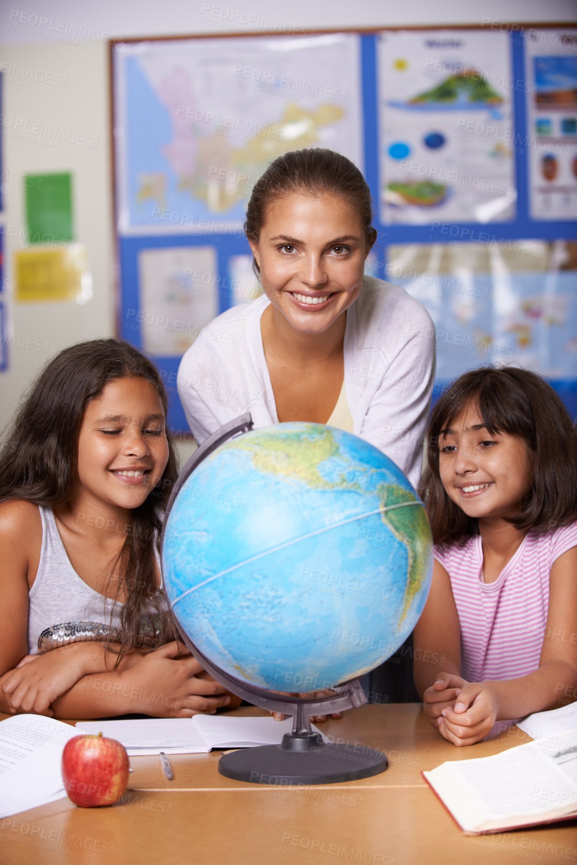 Buy stock photo Woman teacher, children and globe in classroom portrait, smile and learning with girl children. School kids, mentor and earth model with notebooks, reading or happy for education, development or info