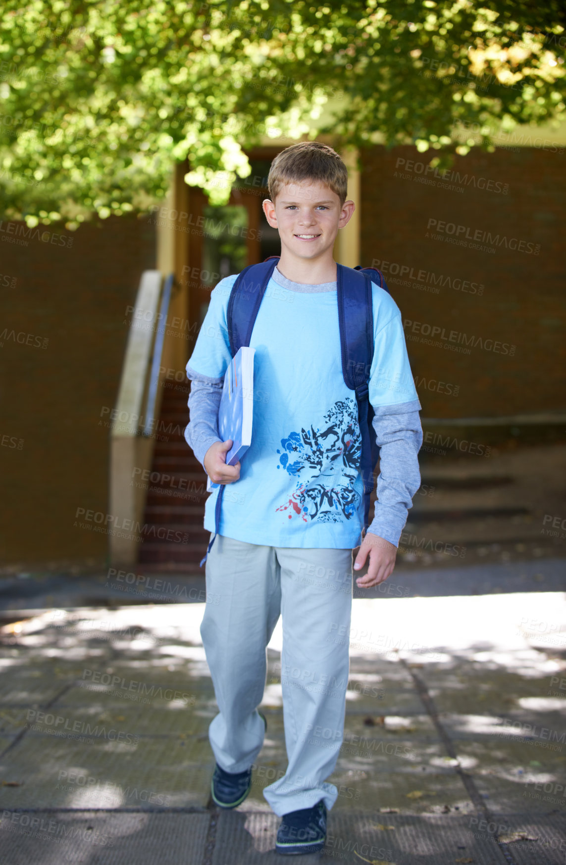 Buy stock photo Portrait, boy and book with backpack, outdoor and smile with knowledge, education and happy. Person, outside and student with childhood development, bag and kid with joy, cheerful and learning