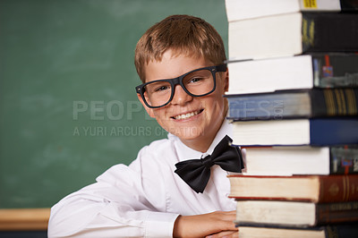 Buy stock photo Boy student, smile and portrait with books, classroom and learning for exam, assessment and studying for knowledge. Child, notebook and happy for education, development and glasses by chalkboard