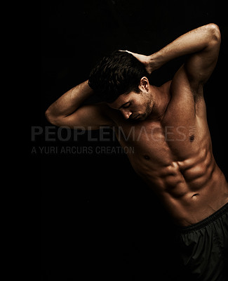 Buy stock photo Well built young man with well defined abs - Isolated on black
