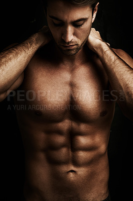 Buy stock photo Muscular young man isolated on black