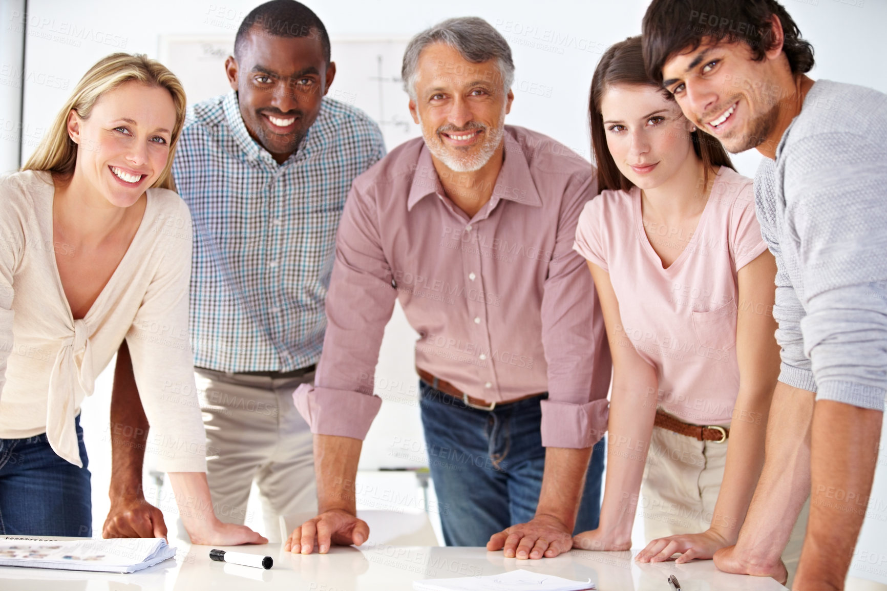 Buy stock photo Shot of a diverse group of colleagues in the office