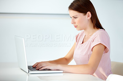 Buy stock photo Business woman, laptop and typing in office at desk for online research, website review and planning social media connection in creative startup. Young designer working at computer in digital agency 