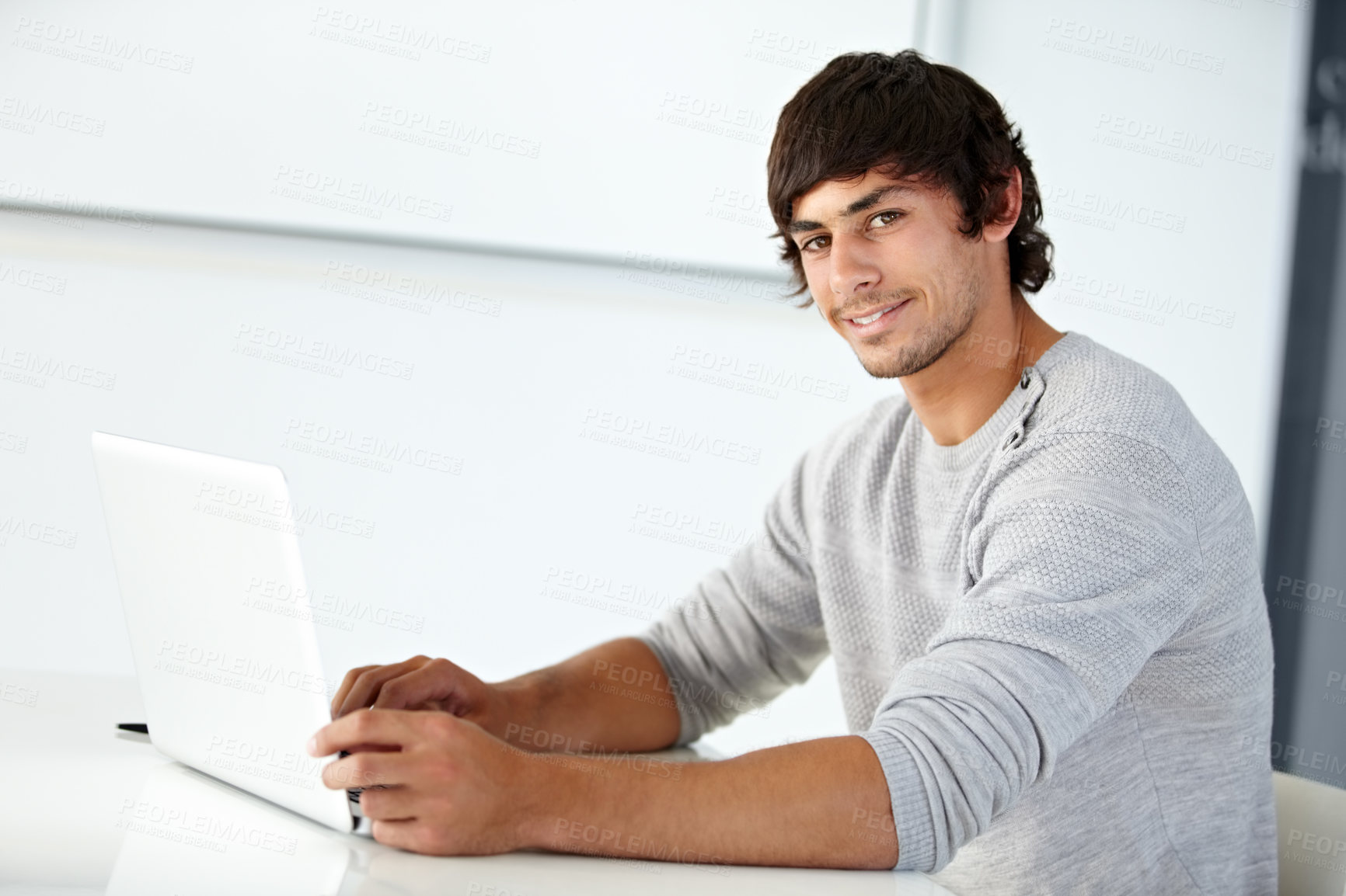 Buy stock photo Man, portrait and happy designer at laptop in office for online research, website review and planning connection at desk. Smile, creative and young employee working on computer in digital agency 