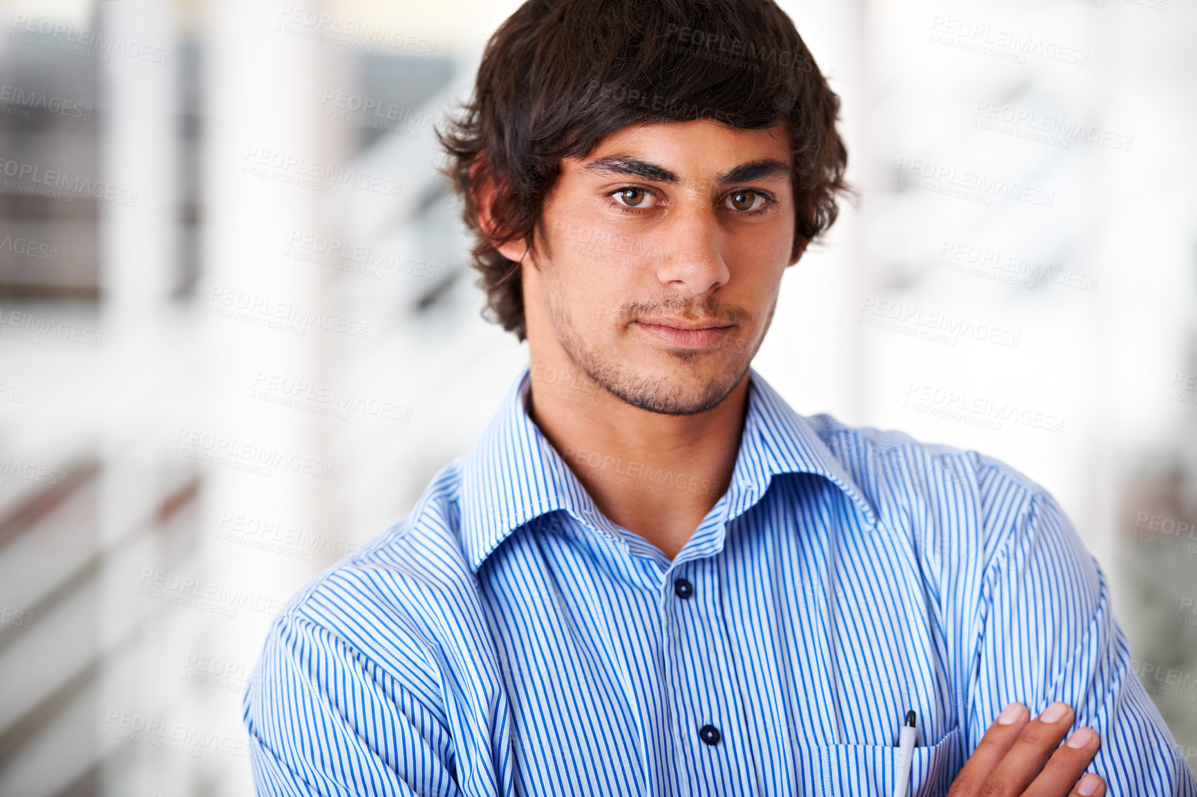 Buy stock photo Portrait, confident and a business man arms crossed in his office for a professional company internship. Face, serious and shirt with a young employee standing in his design agency workplace