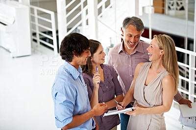 Buy stock photo Business people, report and discussion in office, laughing and planning or brainstorming in lobby. Team, support and collaboration or group of employees in communication, ideas and problem solving