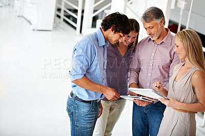 Buy stock photo Business people, documents and discussion in office, planning and brainstorming in lobby or report. Team, support and collaboration or group of employees in communication, ideas and problem solving
