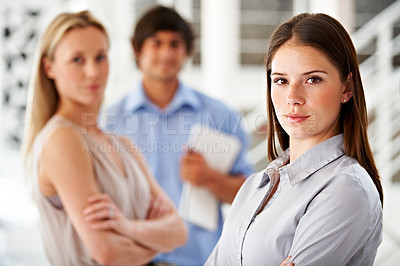 Buy stock photo Office, serious and portrait of business woman with team for leadership, confidence and pride. Corporate, startup company and worker with staff for meeting, planning and collaboration in workplace