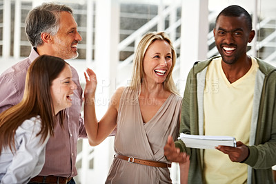Buy stock photo Business people, friends and laughing together in office, funny conversation and speaking in workplace. Colleagues, comic and comedy in collaboration at agency, happy and paperwork or silly joke