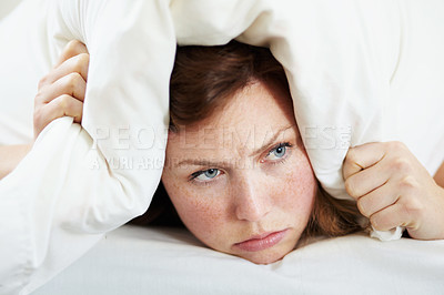 Buy stock photo Insomnia, noise and woman with pillow on ears to block loud sound, sleep fail and tired on bed in bedroom. Stress, person and covering head with cushion for problem, tinnitus and frustrated at night.