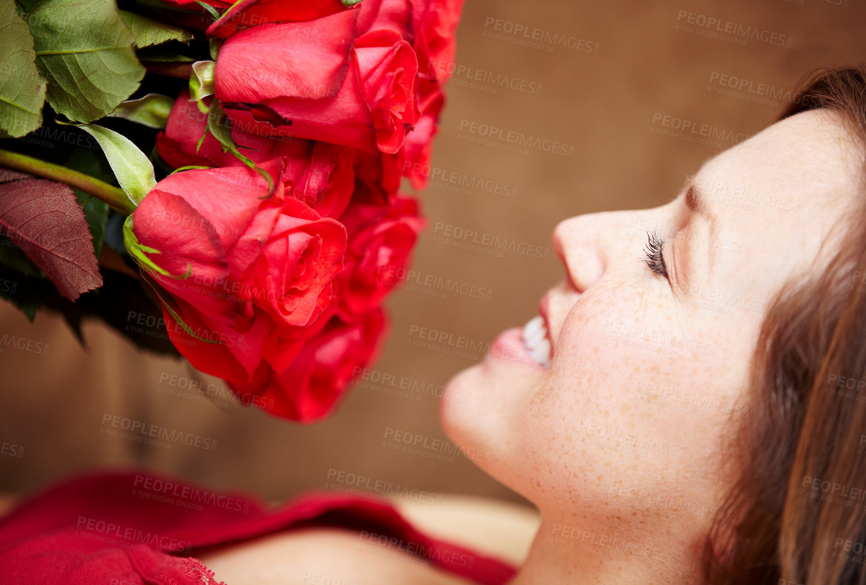 Buy stock photo Woman, smell roses and smile for valentines day gift, present and celebration of love, floral fragrance and bouquet. Happy female person, face and red flowers of plants in bloom, blossom and perfume