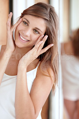 Buy stock photo Mirror, facial massage and happy woman in bathroom for morning skincare routine, dermatology and beauty. Smile, reflection and girl with acupressure on face, cosmetics and skin care glow in home.