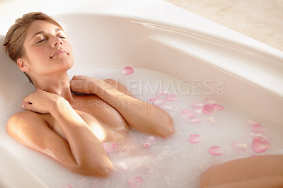 Buy stock photo An attractive young woman taking a relaxing bath