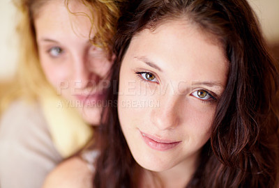 Buy stock photo Closeup portrait of two sisters sitting at home