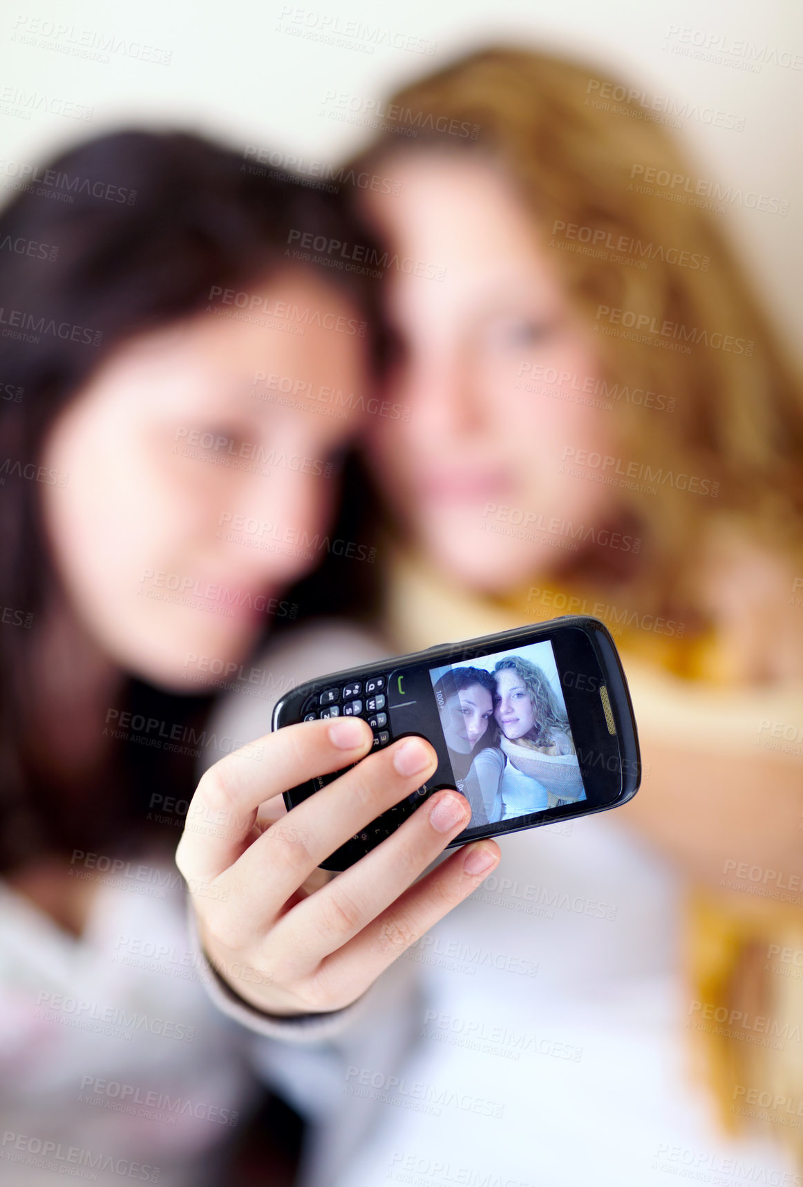 Buy stock photo Phone screen, selfie and lesbian couple hug with love, care and bonding in their home together. Lgbtq, profile picture and people embrace in a house with support, acceptance and memory or photography
