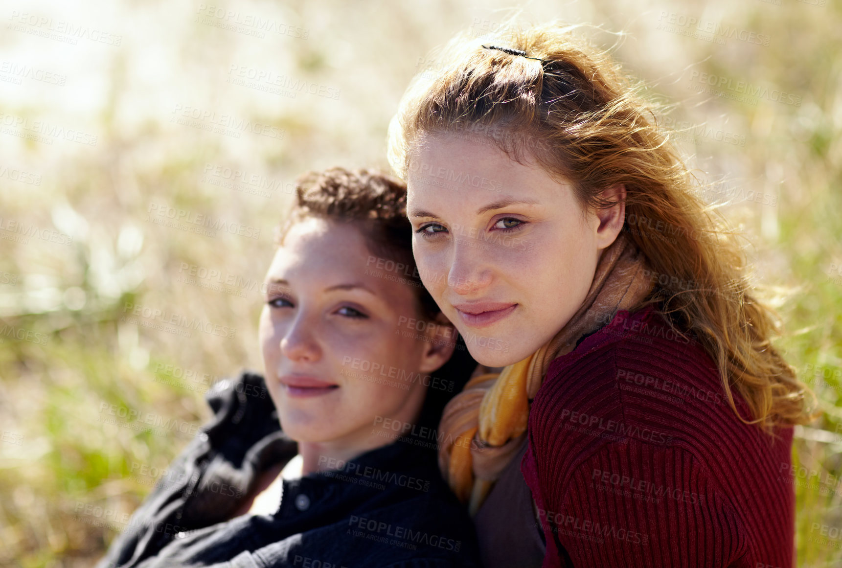 Buy stock photo Love, portrait and lesbian couple relax in a park with peace, bonding or sharing moment in nature together. Lgbt, face and people embrace on a field with trust, comfort or acceptance and romance