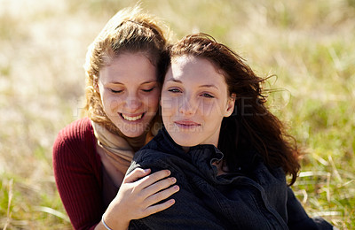 Buy stock photo Love, relax and lesbian couple hug in a park with peace, bonding or sharing moment in nature together. Lgbt, support and people embrace on a field with trust, comfort or gratitude and romance outdoor