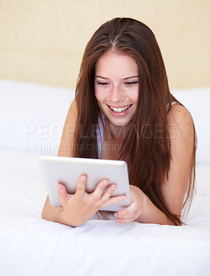 Buy stock photo Woman, tablet and relax on bed with internet, social media or online streaming service for film choice or movies. Happy young person reading or watch on her digital technology in a bedroom or at home