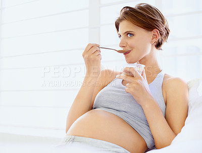 Buy stock photo Breakfast in bed, eating and pregnant woman with chocolate pudding in a house, calm and hungry. Sugar, face and female person in bedroom with pregnancy nutrition for health, balance or utero wellness