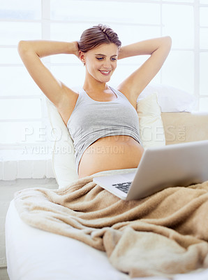 Buy stock photo Pregnant woman, laptop and online to relax in bedroom, wellness and subscription on maternity leave in house. Person, happy or computer with technology on bed, streaming and social media in apartment