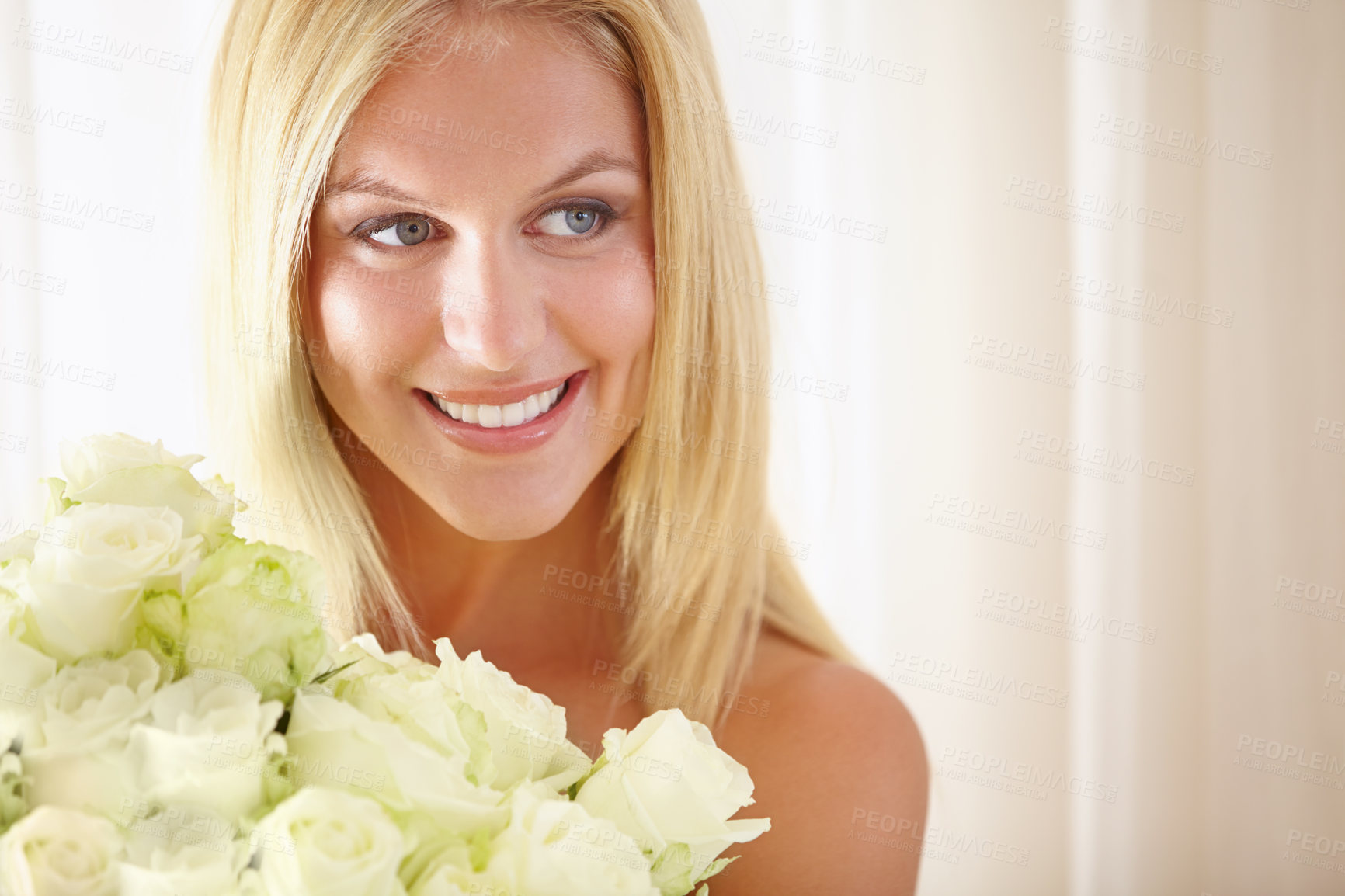 Buy stock photo Face, smile or thinking and woman with flowers closeup in her home for romance on valentines day. Beauty, rose bouquet and a happy young blonde woman in her apartment for anniversary celebration