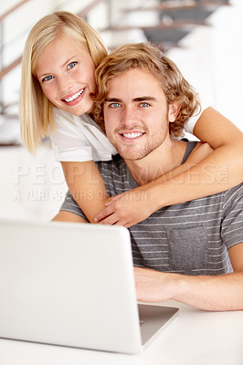 Buy stock photo Portrait of a young couple using a laptop at home
