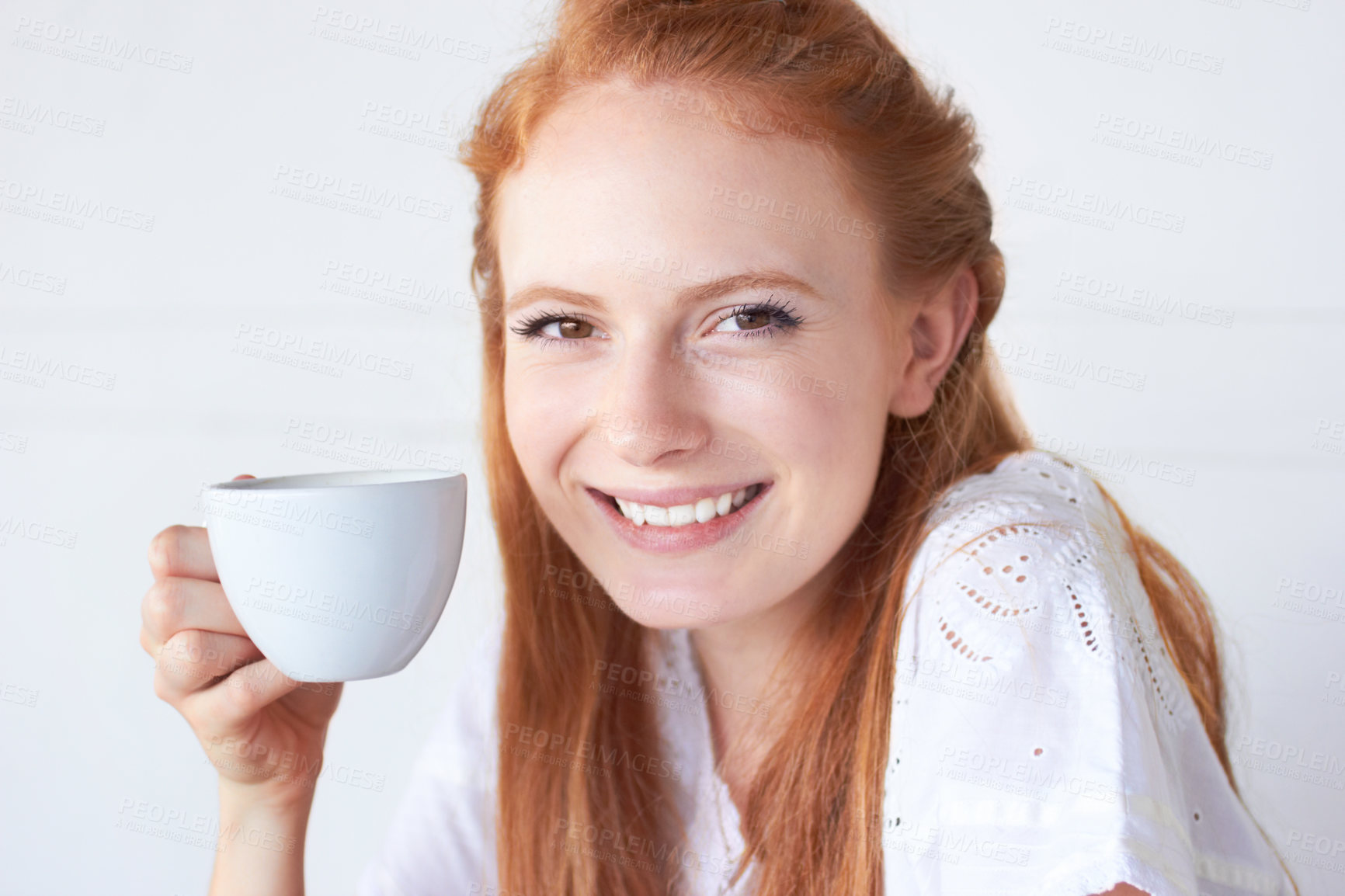 Buy stock photo Happy, smile and portrait of a woman with coffee in a studio in the morning on a weekend. Happiness, excited and face of a female model drinking a cappuccino, caffeine or latte by a white background.