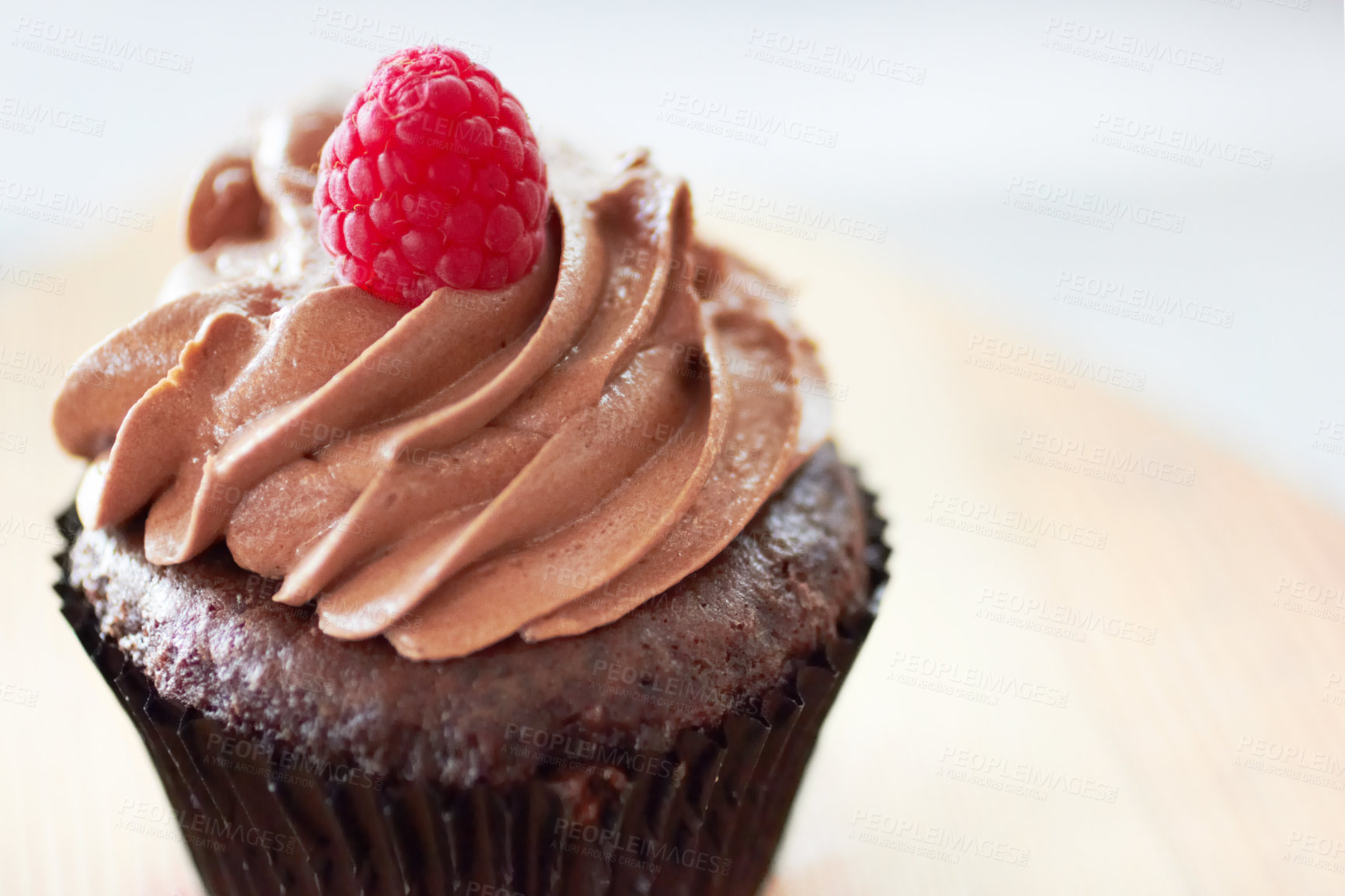 Buy stock photo Cropped shot of a freshly baked cupcake