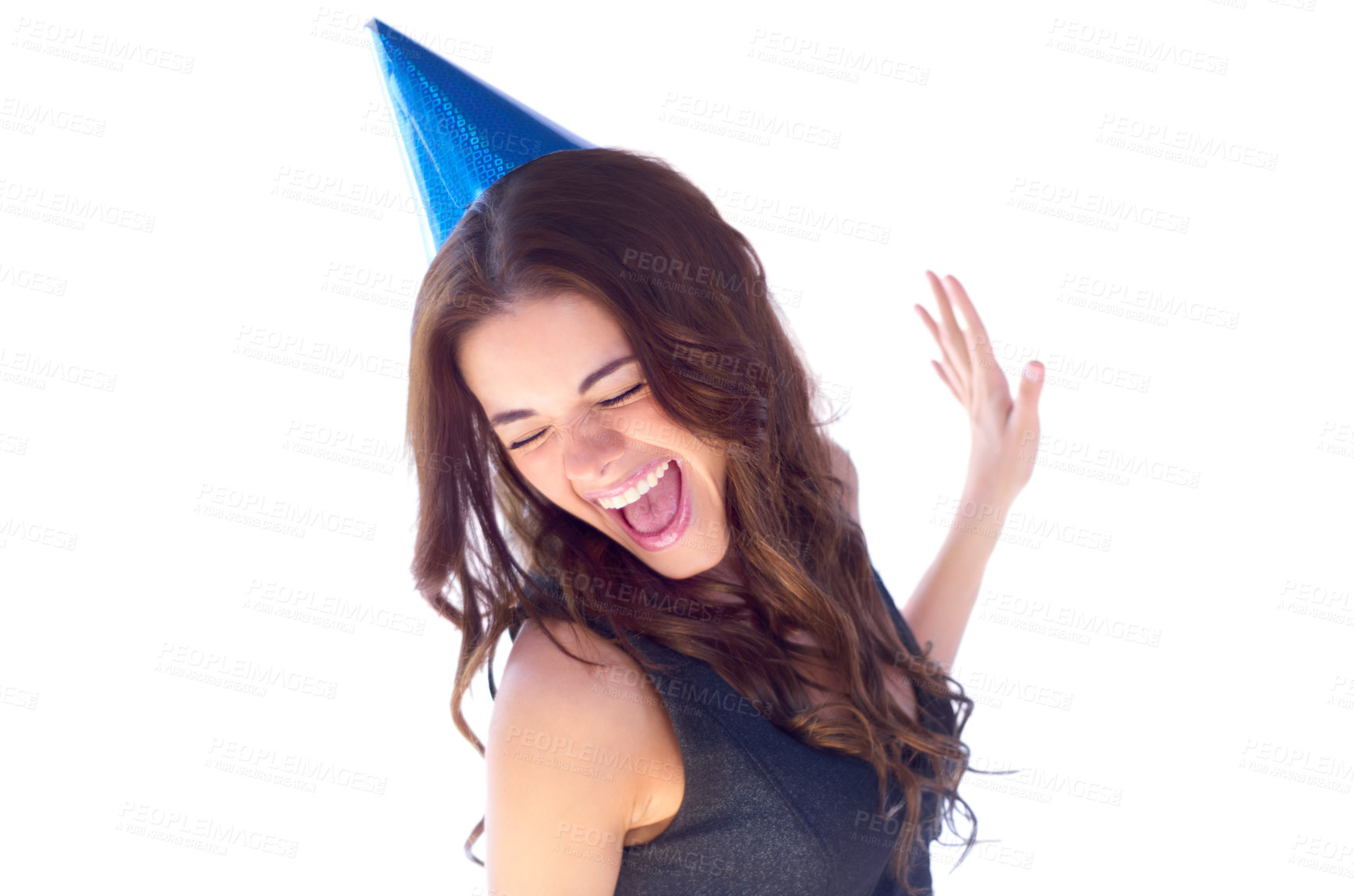 Buy stock photo An attractive young woman dancing while wearing a party hat
