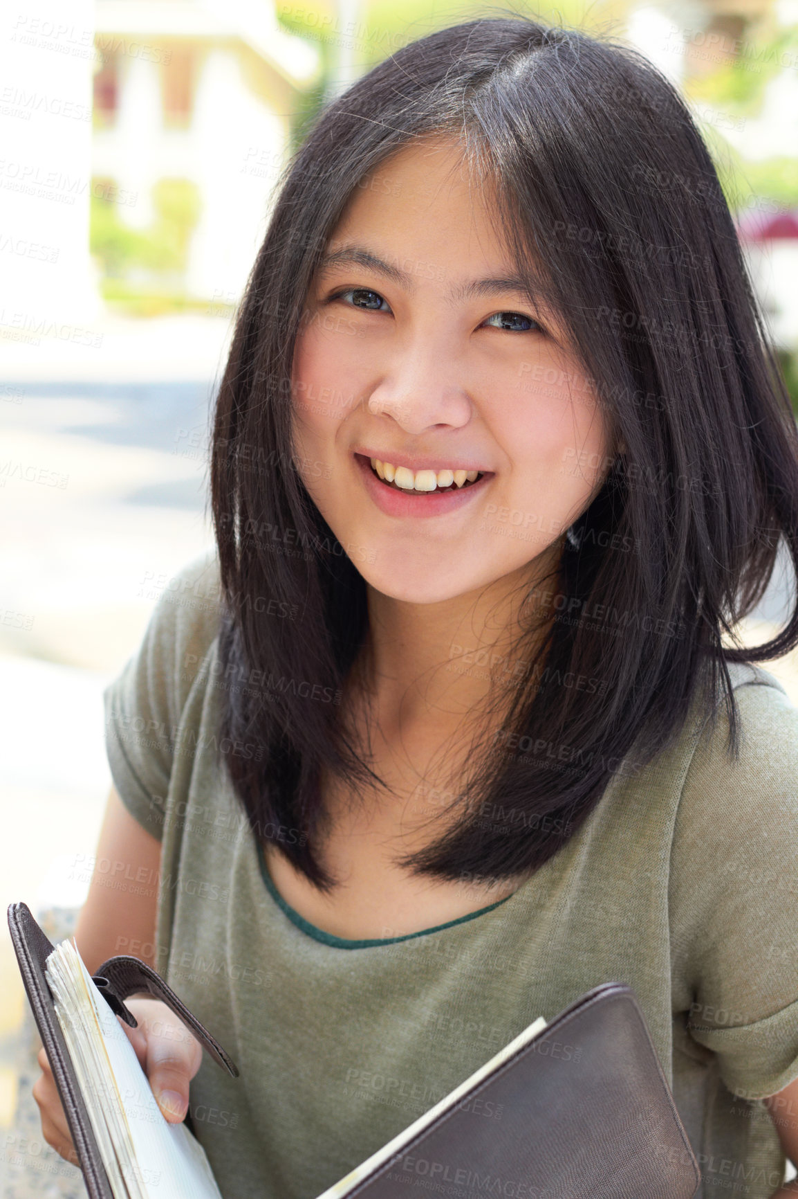Buy stock photo Portrait, education and book with an asian woman student on university campus for learning or development. Study, smile or happy with a young female college pupil outdoor to study or learn in summer