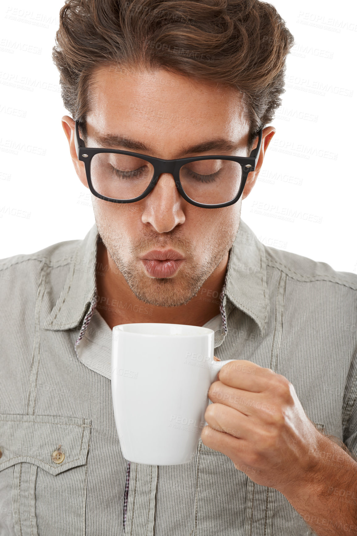 Buy stock photo Man, blowing and coffee or hot beverage in studio for caffeine espresso, morning motivation or white background. 
Male person, model and warm drink latte for aroma scent cappuccino or mockup space