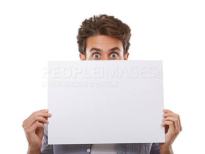 Buy stock photo Portrait, surprise and man hide on poster, sign and advertising on mockup space isolated on white studio background. Face, shock and peeking on paper banner, sales promo or blank placard presentation