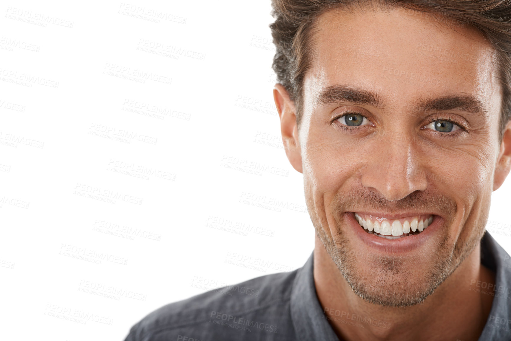 Buy stock photo Portrait of a handsome young man smiling against a white background
