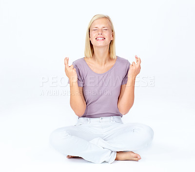 Buy stock photo Nervous woman, hands or fingers crossed for hope, good luck or wish on studio background, marketing space or mockup. Beautiful model, hand gesture or anxiety on white mock up backdrop for winner deal