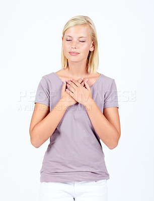 Buy stock photo Peace, calm and woman with hands on heart for love, worship and gratitude on a white background. Happy, grateful and girl praying for religion or listening to heartbeat on a studio background