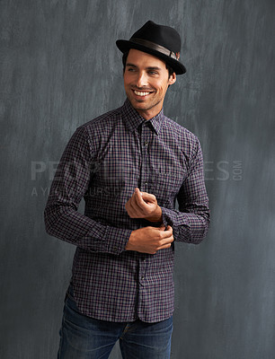 Buy stock photo Fashion, happy and man on gray background with confidence in trendy style, clothes and casual outfit. Smile, handsome and face of person on texture wall with accessory, pride and positive attitude