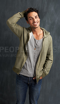 Buy stock photo Fashion, confidence and portrait of man on gray background with trendy style, clothes and casual outfit. Happy, handsome and face of person on texture wall with smile, pride and positive attitude