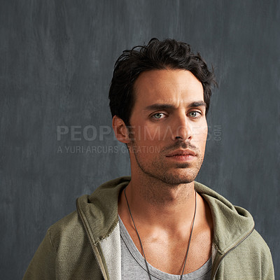 Buy stock photo Serious, upset and portrait of man by a wall with disappointed, angry or moody facial expression. Frown, confused and young male person from Canada with doubtful and skeptical face by gray background
