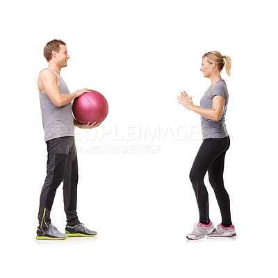 Buy stock photo Coaching, man and woman with gym ball for fitness in studio, body wellness and support. Sports workout, fit girl and personal trainer with sphere for balance, training and power on white background.