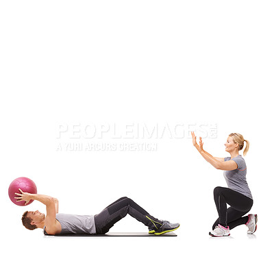 Buy stock photo Exercise, man and woman with gym ball for fitness in studio, body wellness and support. Sports workout, fit girl and personal trainer with sphere for balance, training and power on white background.