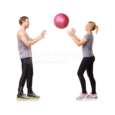 Buy stock photo A man and woman exercising  by throwing a medicine ball to each other